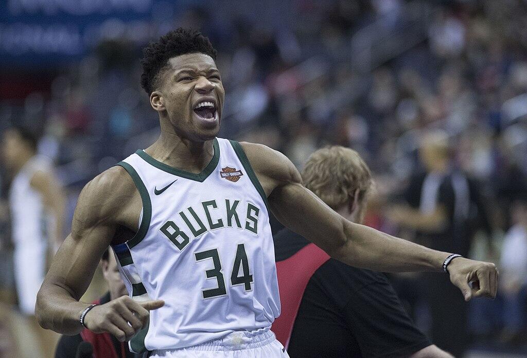 Giannis Antetokounmpo celebrating during a basketball game.